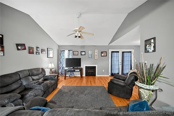 a living room with furniture fireplace and a flat screen tv