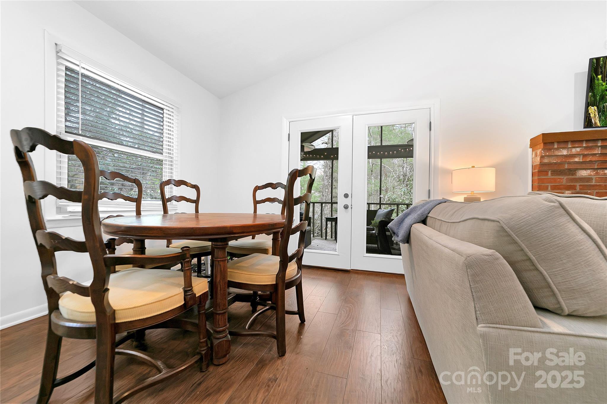 3703 Connestee Trail Brevard, NC 28712 - Photo 11 of 38 a view of a dining room with furniture and wooden floor