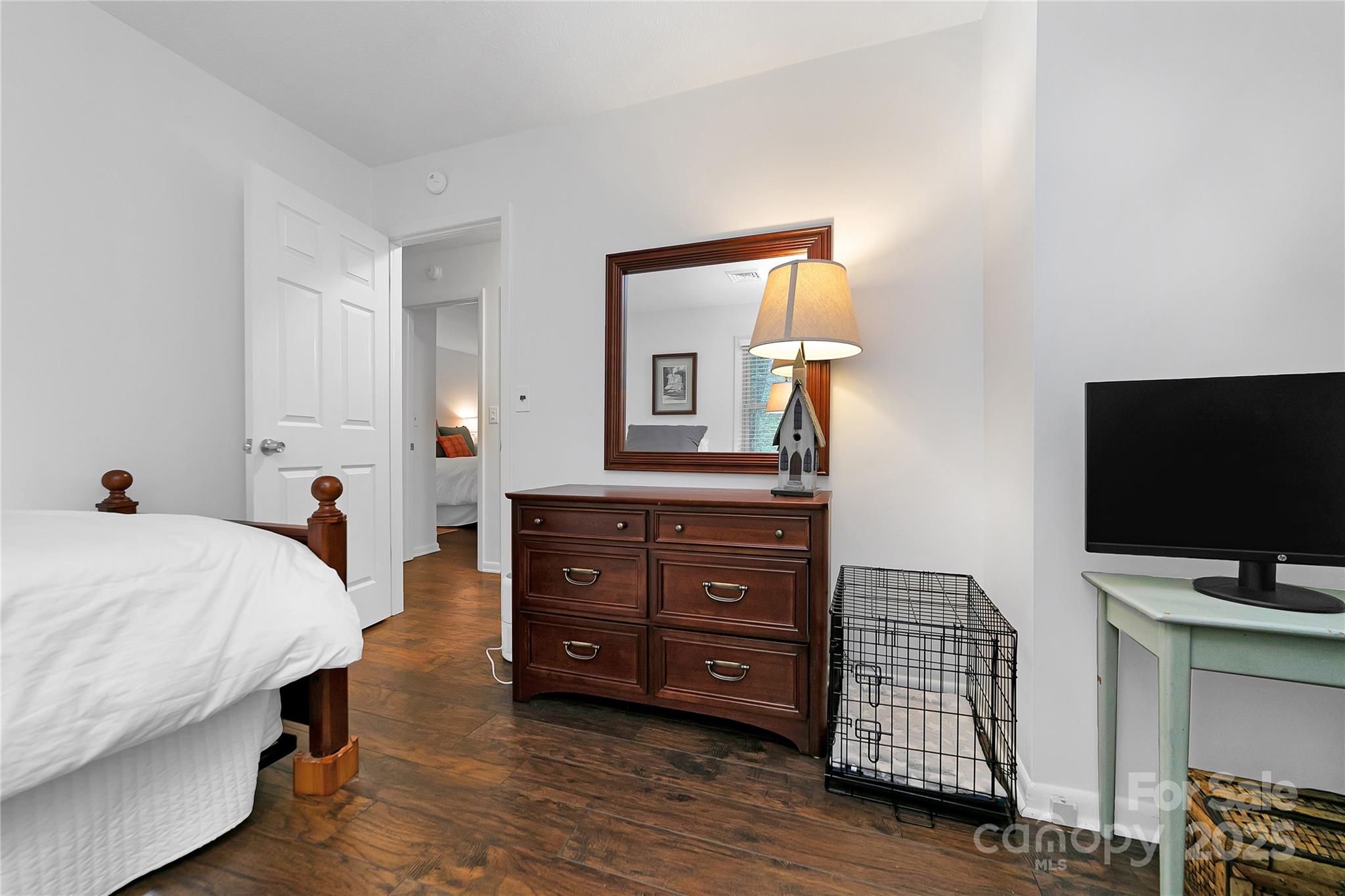 3703 Connestee Trail Brevard, NC 28712 - Photo 19 of 38 a bedroom with a bed and flat screen tv