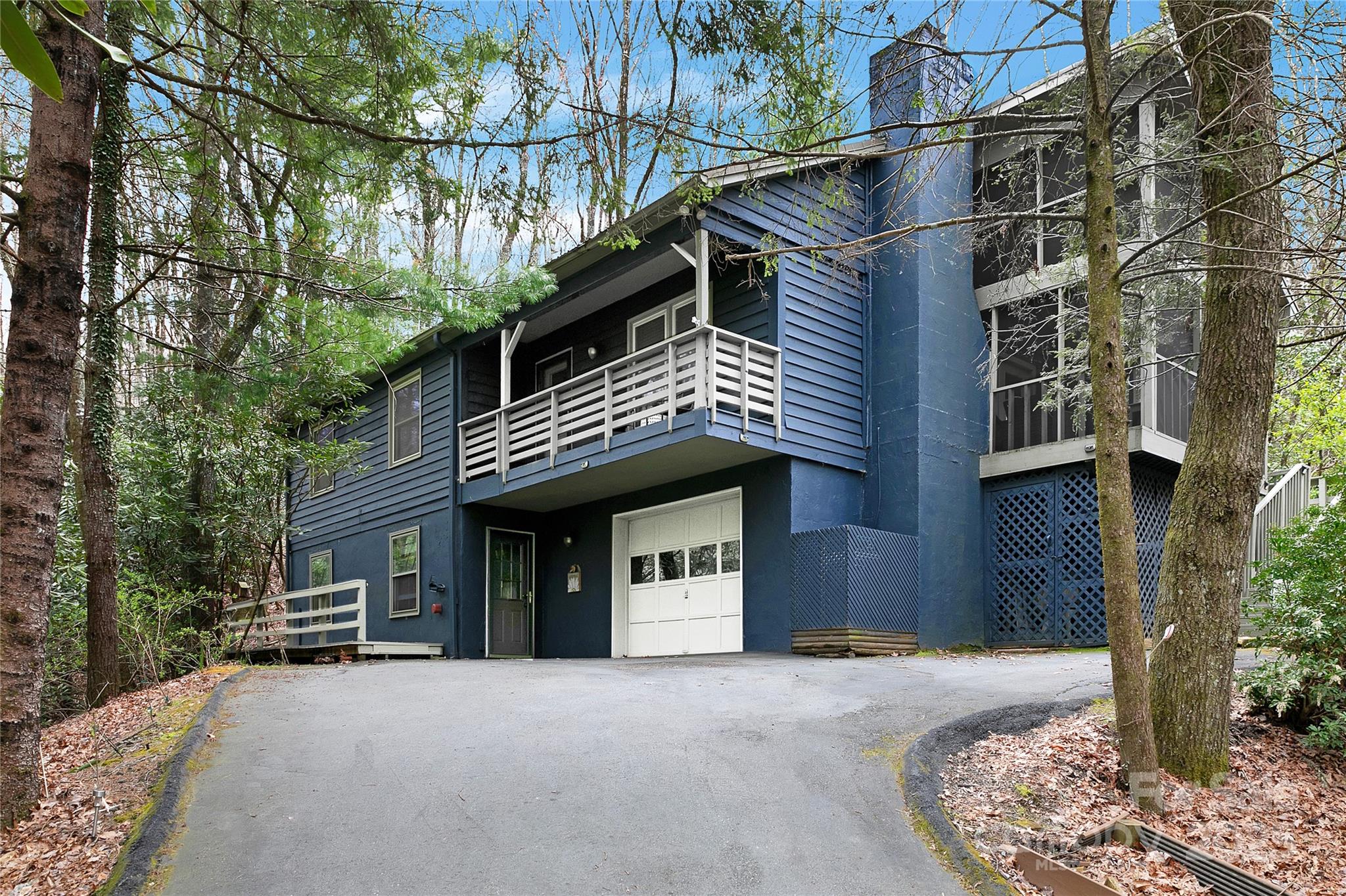 3703 Connestee Trail Brevard, NC 28712 - Photo 2 of 38 a front view of a house with a yard