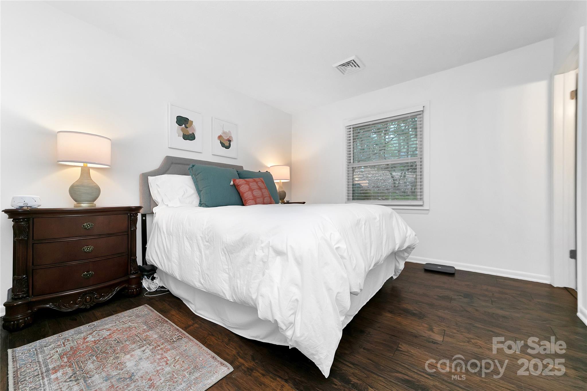 3703 Connestee Trail Brevard, NC 28712 - Photo 22 of 38 a bedroom with a bed and a lamp