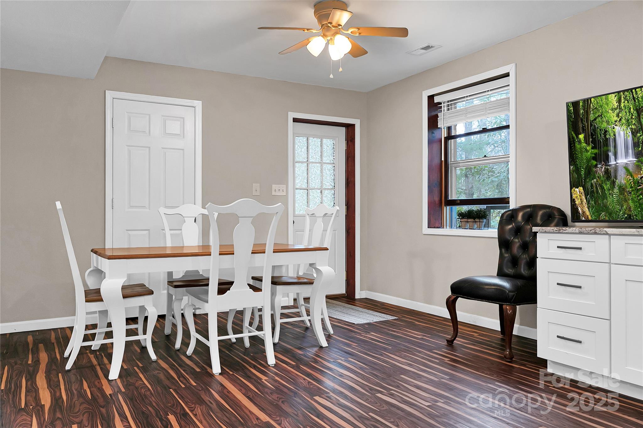 3703 Connestee Trail Brevard, NC 28712 - Photo 29 of 38 a view of a dining room with furniture a chandelier and wooden floor