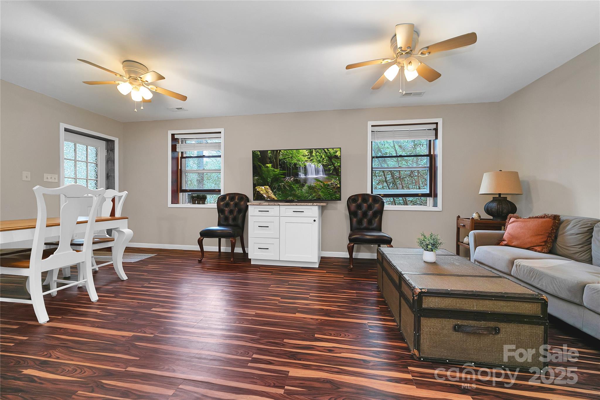 3703 Connestee Trail Brevard, NC 28712 - Photo 30 of 38 a living room with furniture and a chandelier