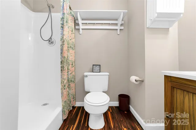 a bathroom with a toilet and a sink