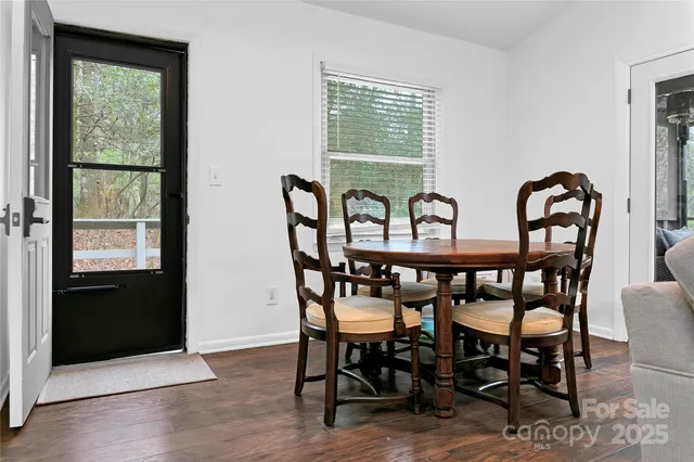 a view of a a dining room with furniture window and outside view