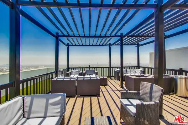a view of a balcony with chairs