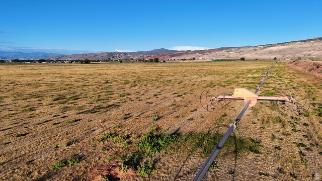 2070 East Tbd Road North Richfield, UT 84701 - Photo 16 of 35 Expansive open land featuring an irrigation system and distant mountain ranges