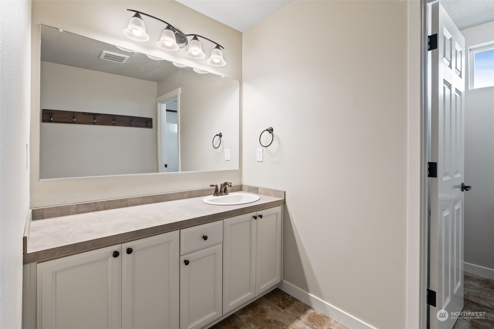1003 North Klein Road Ritzville, WA 99169 - Photo 20 of 34 a bathroom with a sink and a mirror