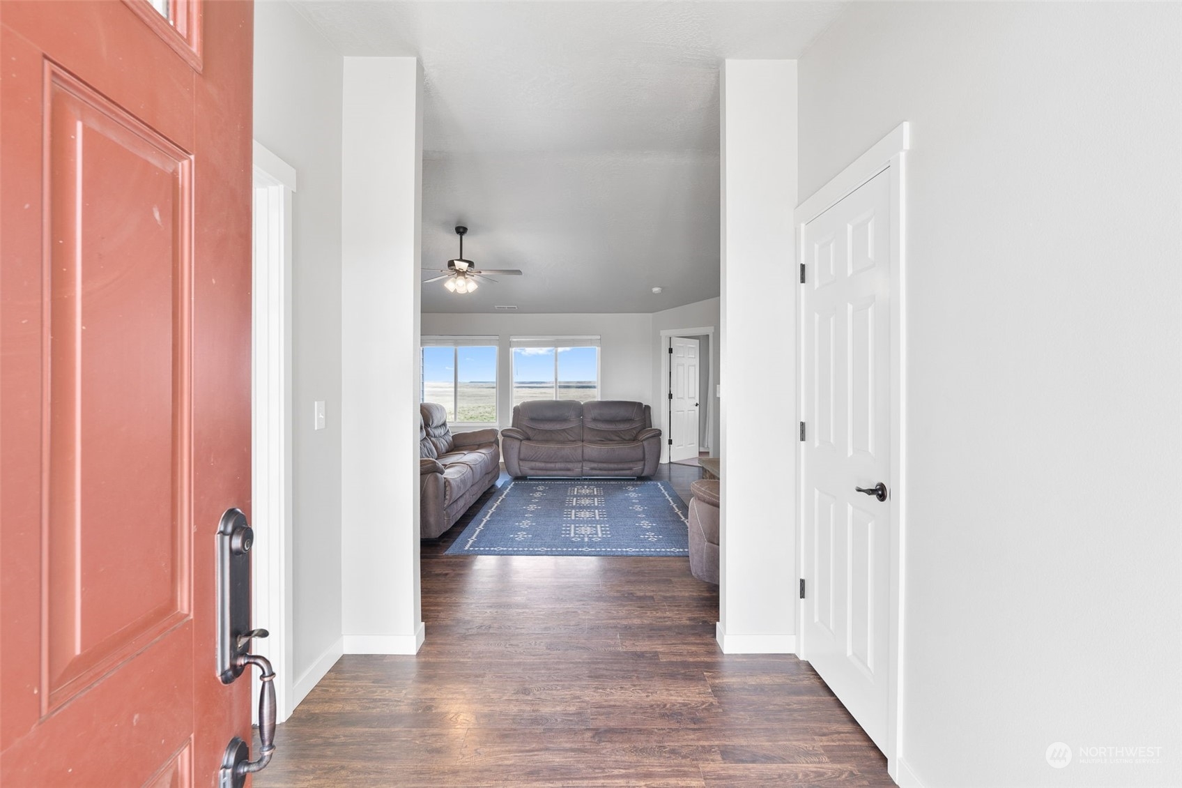 1003 North Klein Road Ritzville, WA 99169 - Photo 2 of 34 a view of a hallway view with wooden floor and staircase