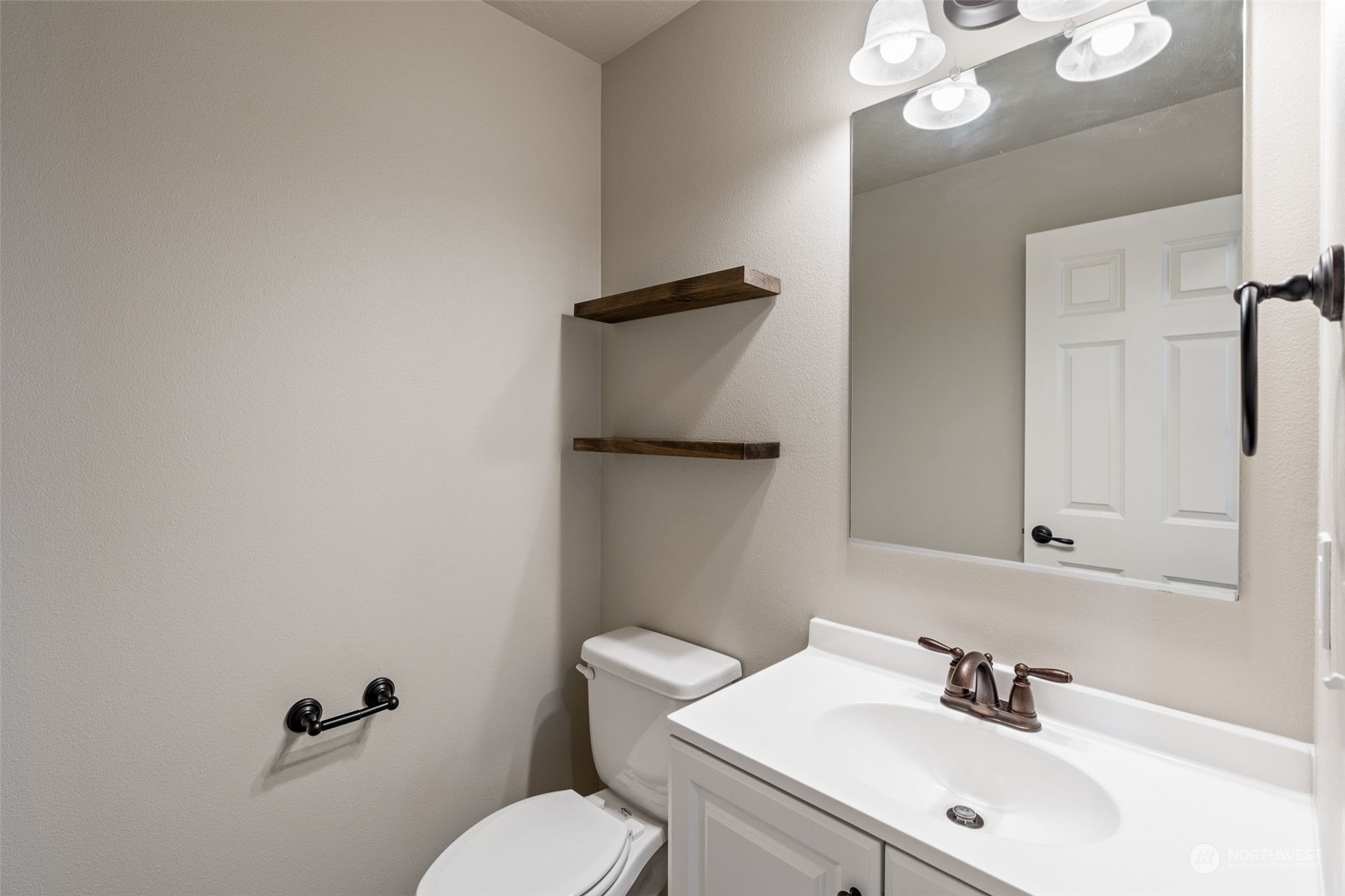 1003 North Klein Road Ritzville, WA 99169 - Photo 24 of 34 a bathroom with a sink mirror and toilet
