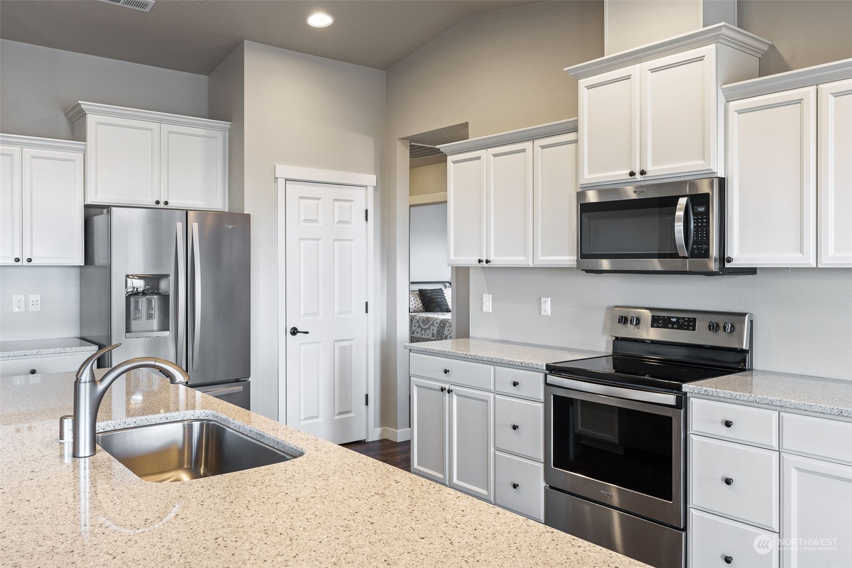 1003 North Klein Road Ritzville, WA 99169 - Photo 6 of 34 a kitchen with stainless steel appliances granite countertop a sink dishwasher a refrigerator and a stove with wooden floor
