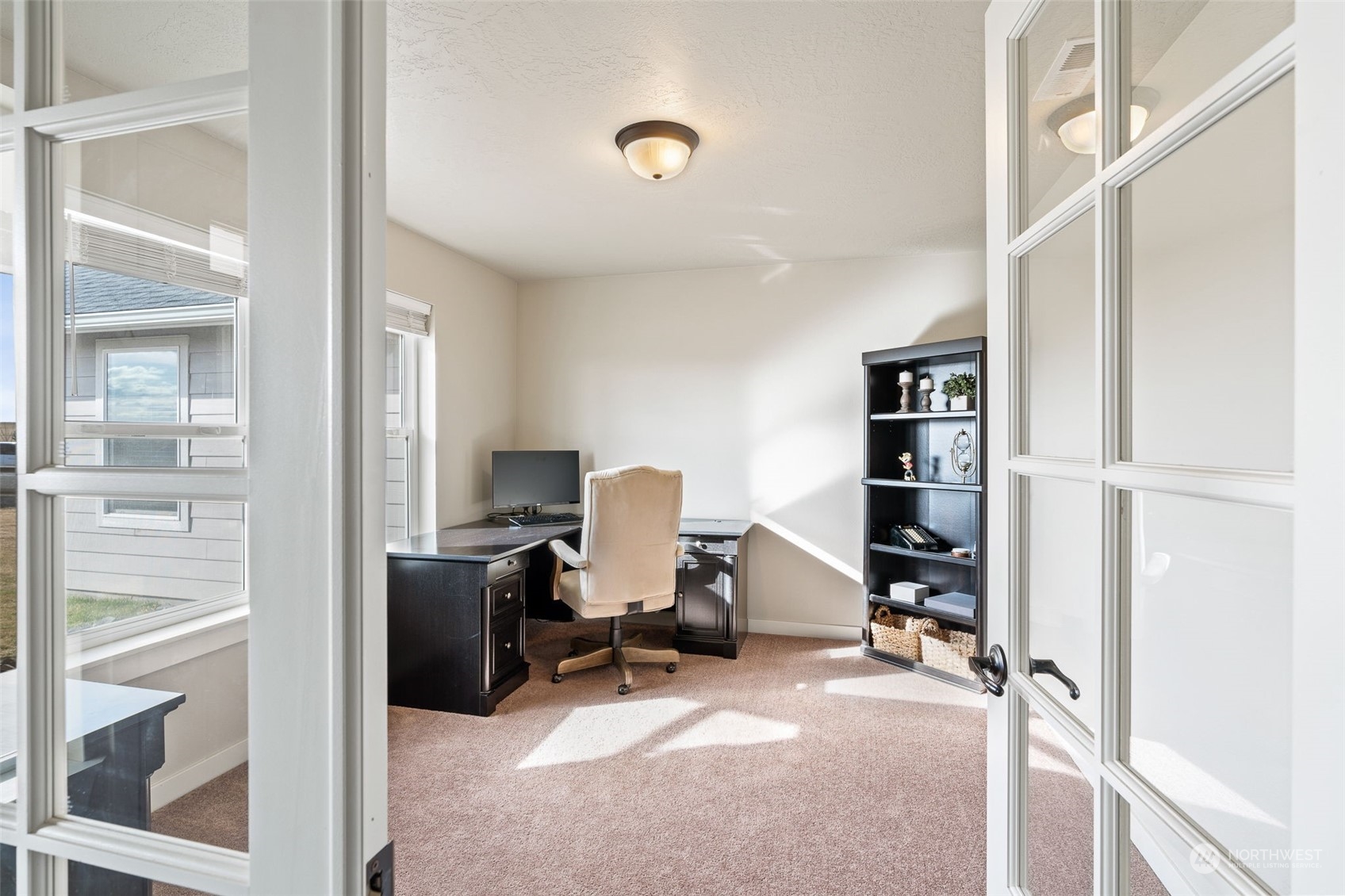 1003 North Klein Road Ritzville, WA 99169 - Photo 9 of 34 a view of a workspace with furniture and a window