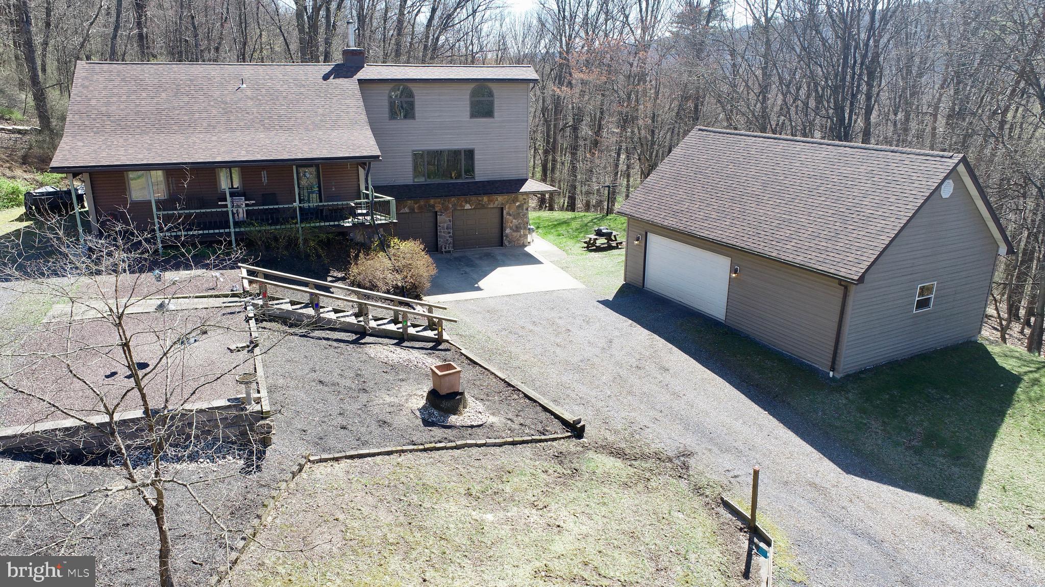 9206 Barkley Lane Huntingdon, PA 16652 - Photo 1 of 88 a view of backyard with barbeque grill and potted plants
