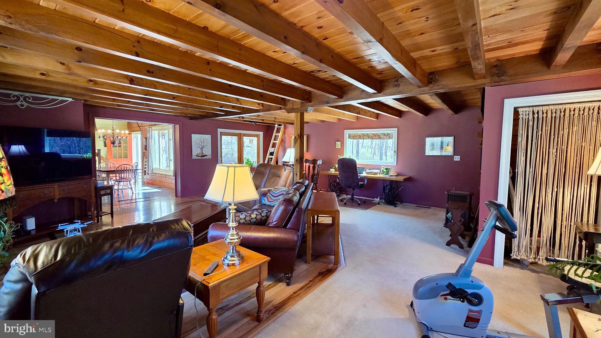9206 Barkley Lane Huntingdon, PA 16652 - Photo 22 of 88 a living room with furniture gym equipment and a chandelier