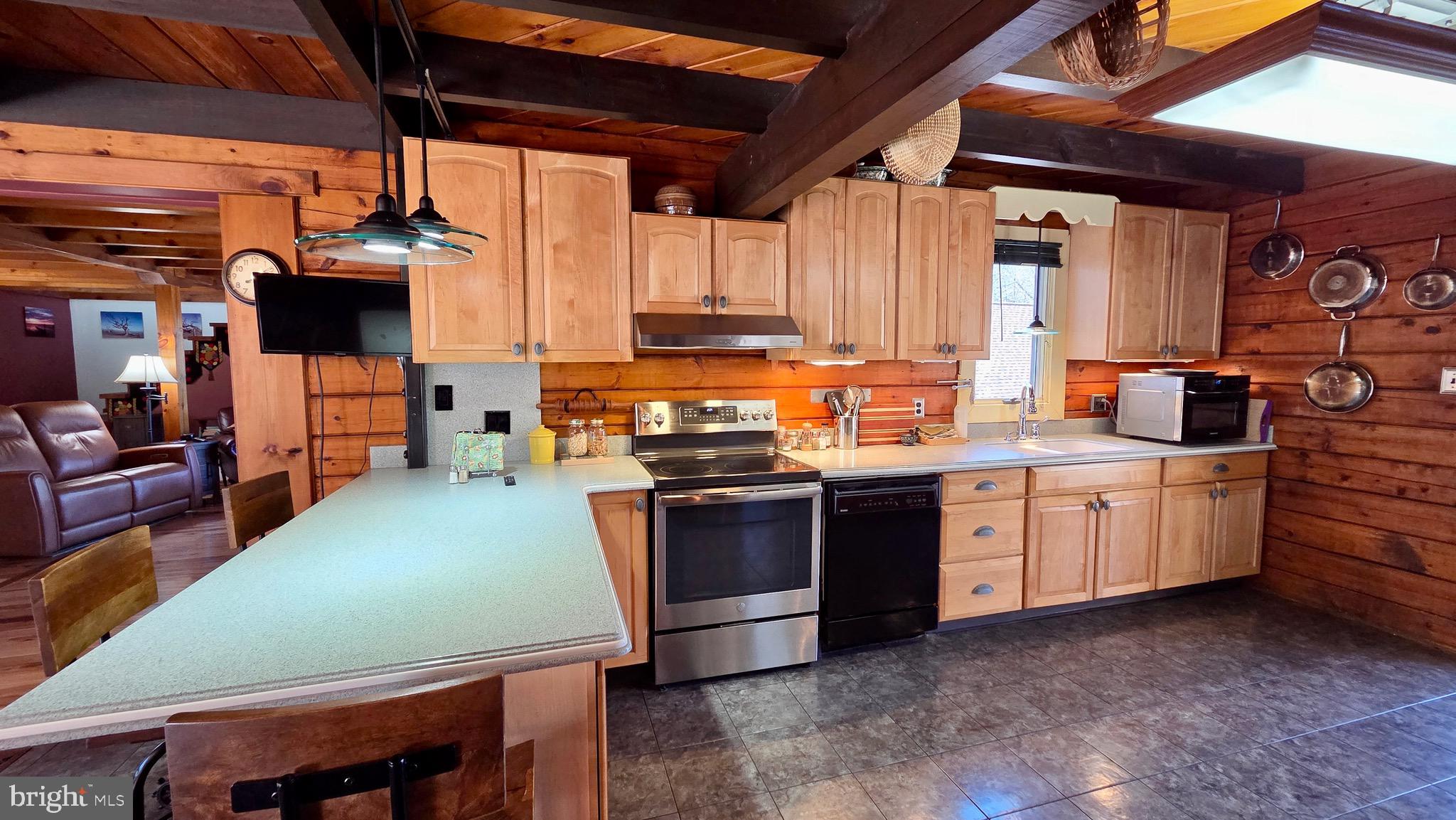 9206 Barkley Lane Huntingdon, PA 16652 - Photo 27 of 88 a kitchen with kitchen island a stove a sink and a refrigerator