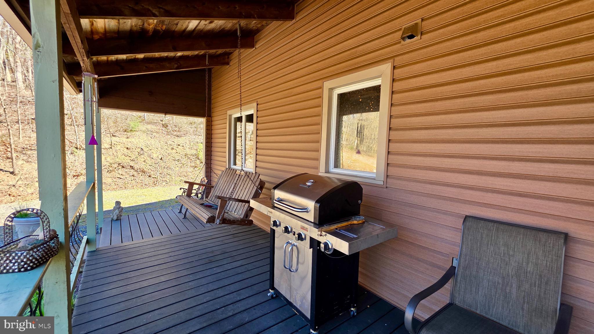 9206 Barkley Lane Huntingdon, PA 16652 - Photo 70 of 88 a view of a deck with wooden floor and outdoor seating