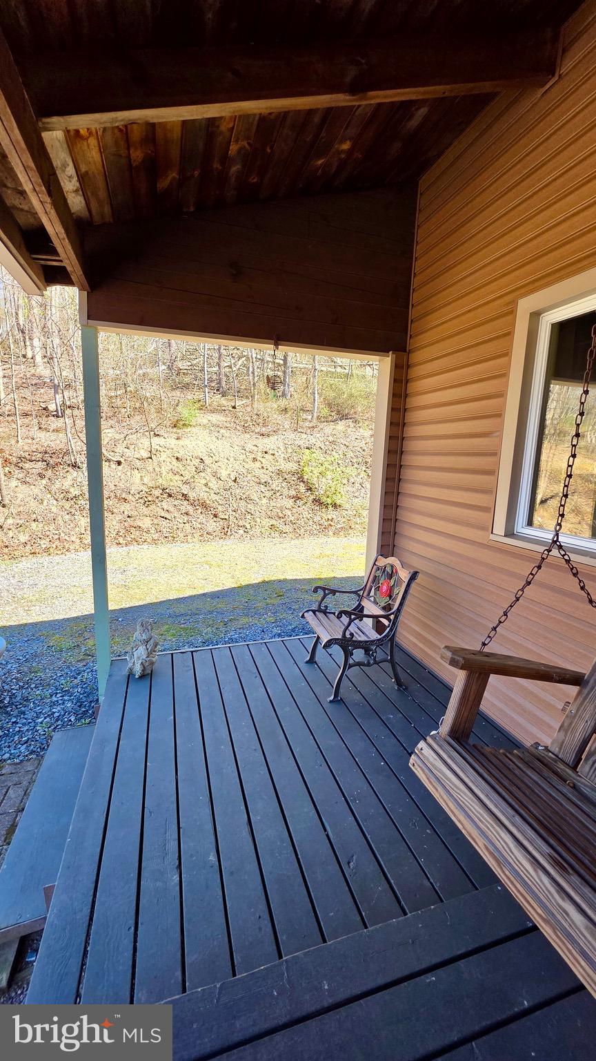 9206 Barkley Lane Huntingdon, PA 16652 - Photo 72 of 88 a view of a balcony with wooden floor and outdoor seating