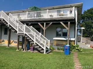 a view of swimming pool with deck and garden