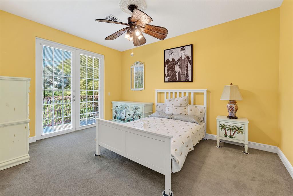 400 Northeast 8th Avenue Fort Lauderdale, FL 33301 - Photo 11 of 25 a bedroom with a bed painting on wall and a large window