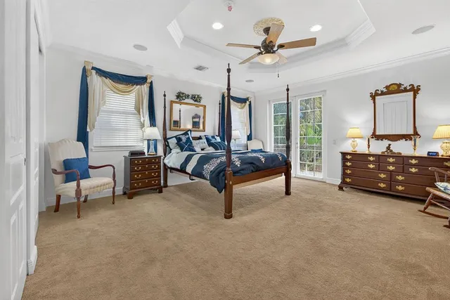 a bathroom with a tub sink vanity granite and a shower