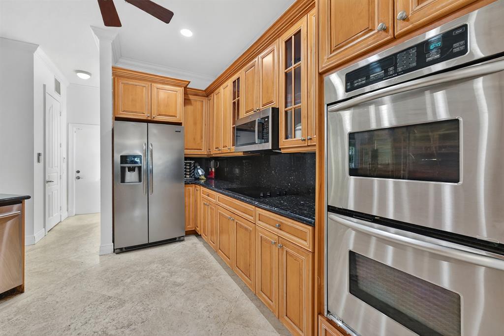 400 Northeast 8th Avenue Fort Lauderdale, FL 33301 - Photo 9 of 25 a kitchen with stainless steel appliances granite countertop a refrigerator and a stove top oven