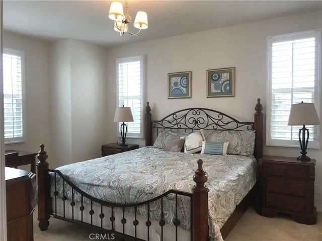 a front view of a house with fountain and garden