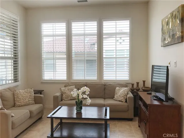a living room with furniture and windows