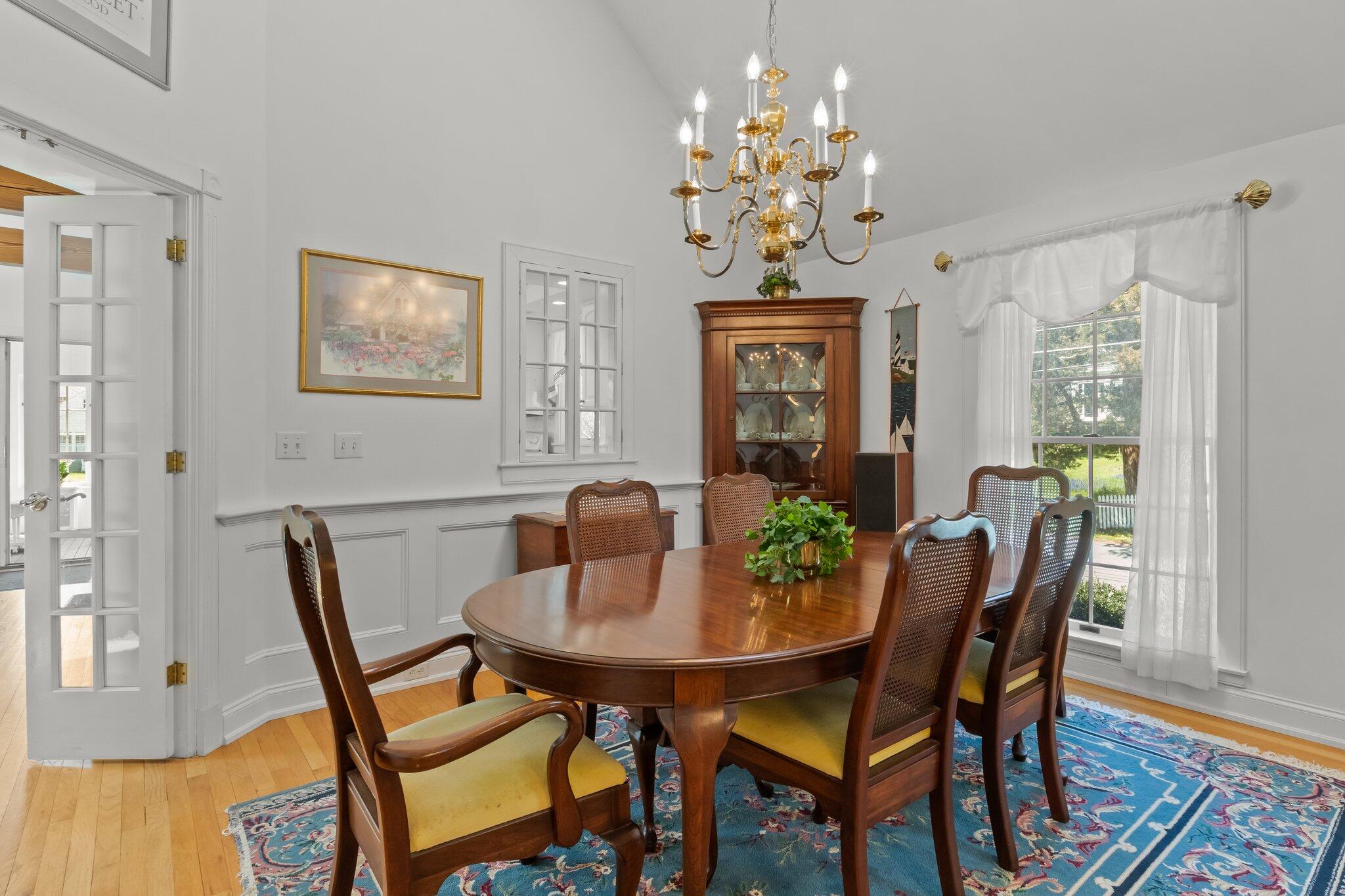 35 Hamblen Farm Road Wellfleet, MA 02667 - Photo 12 of 62 a view of a dining room with furniture and chandelier