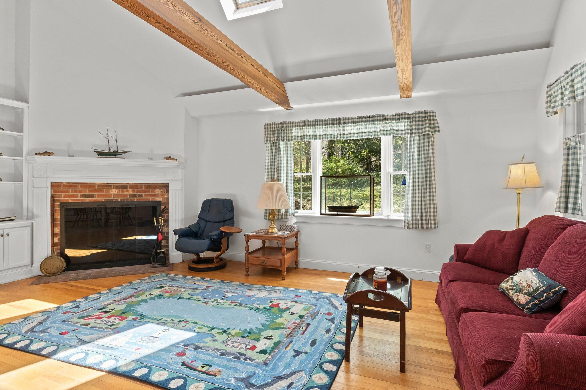 35 Hamblen Farm Road Wellfleet, MA 02667 - Photo 16 of 62 a living room with furniture and a fireplace