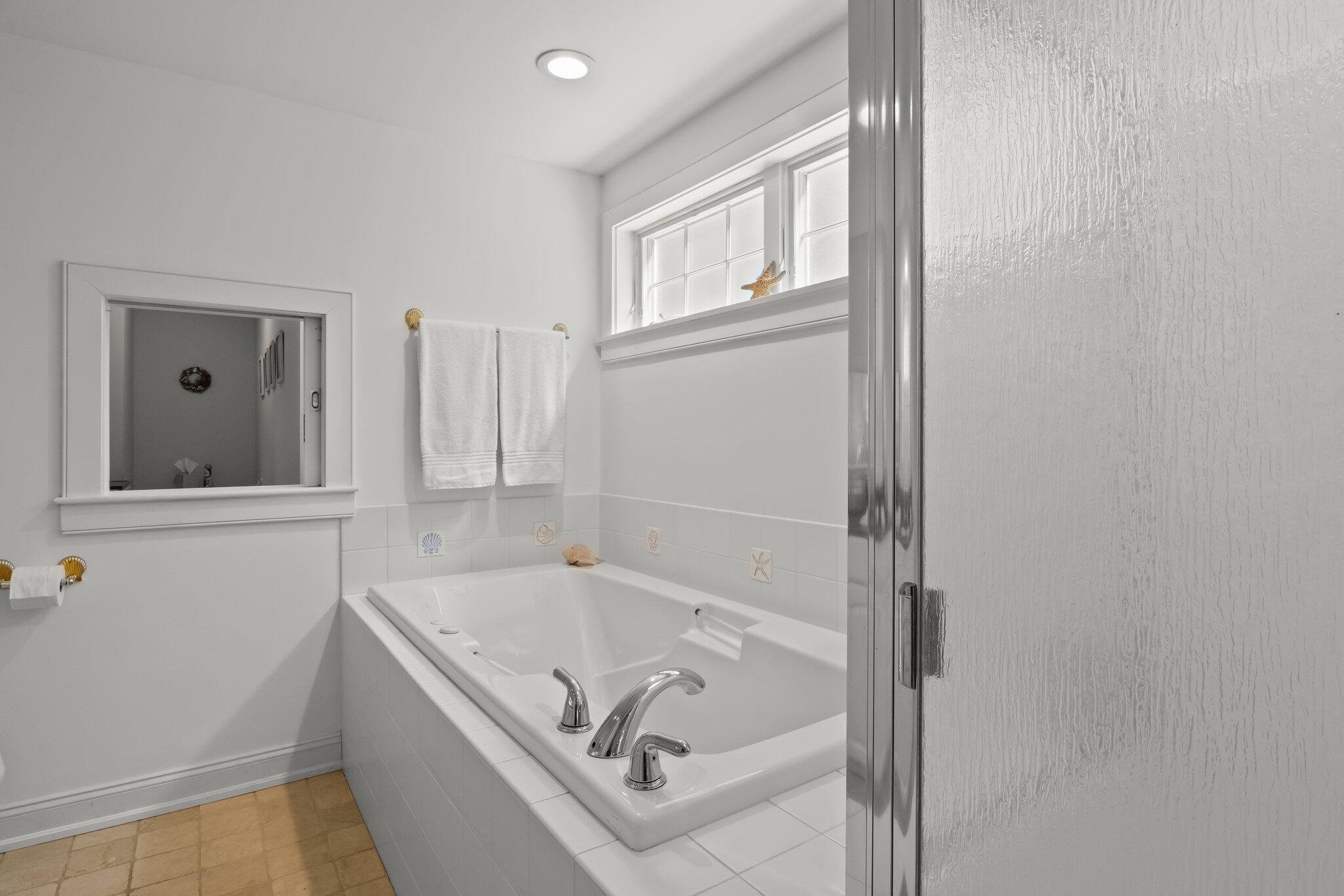 35 Hamblen Farm Road Wellfleet, MA 02667 - Photo 31 of 62 a bathroom with a tub sink and mirror
