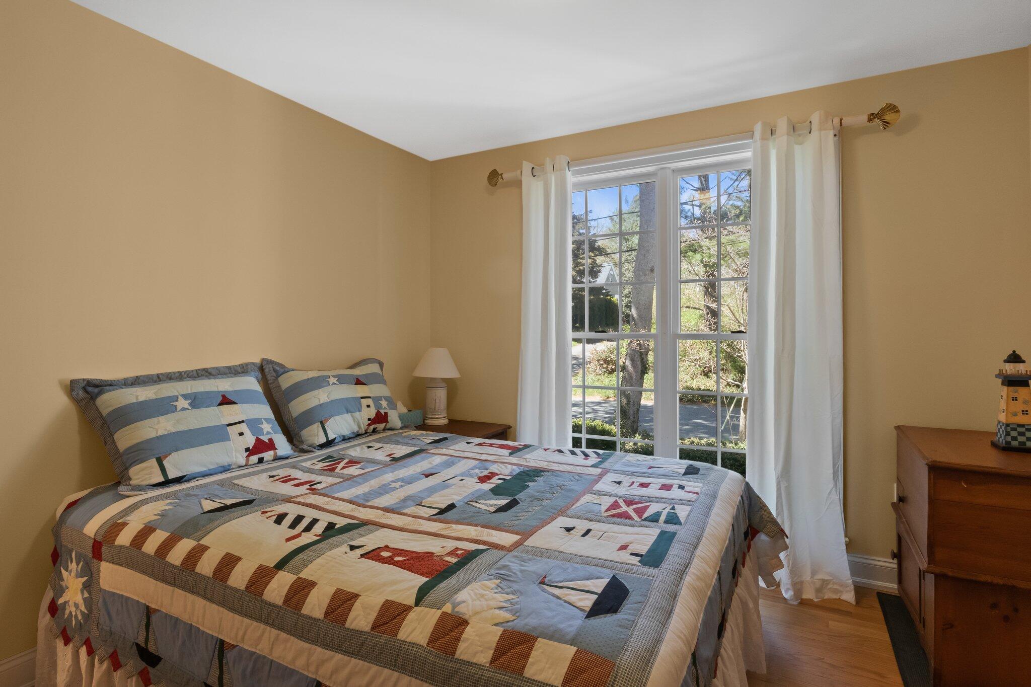 35 Hamblen Farm Road Wellfleet, MA 02667 - Photo 33 of 62 a bed sitting in a bedroom next to a window
