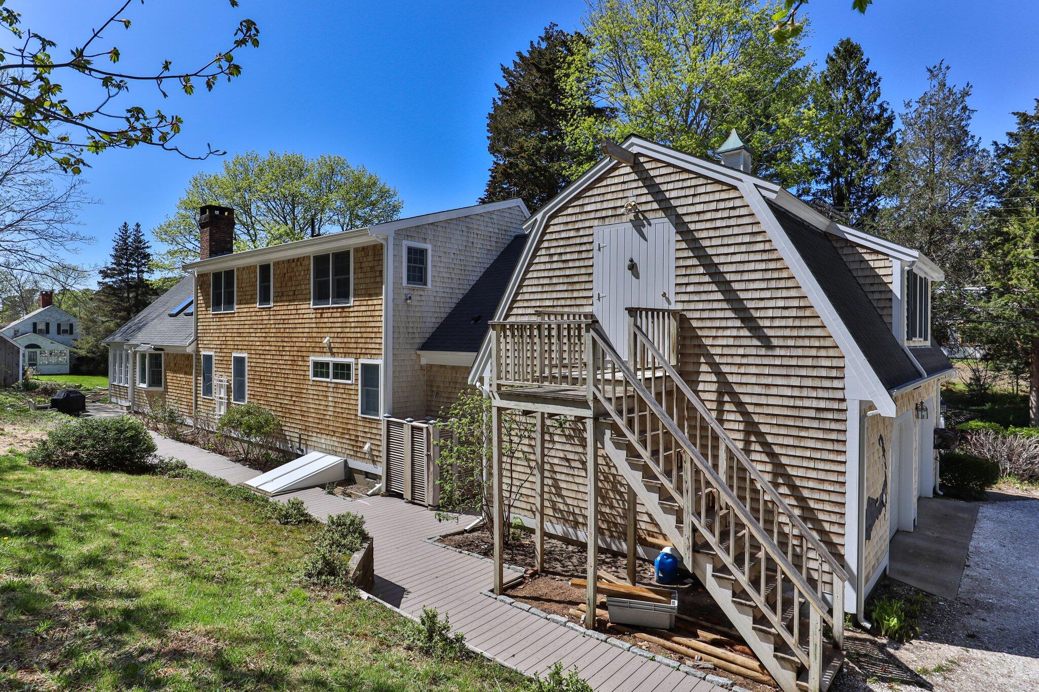 35 Hamblen Farm Road Wellfleet, MA 02667 - Photo 48 of 62 a view of a house with backyard and sitting area