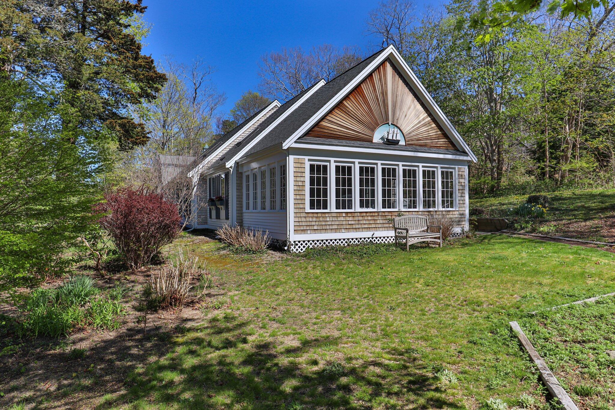35 Hamblen Farm Road Wellfleet, MA 02667 - Photo 54 of 62 a view of front of house with a yard