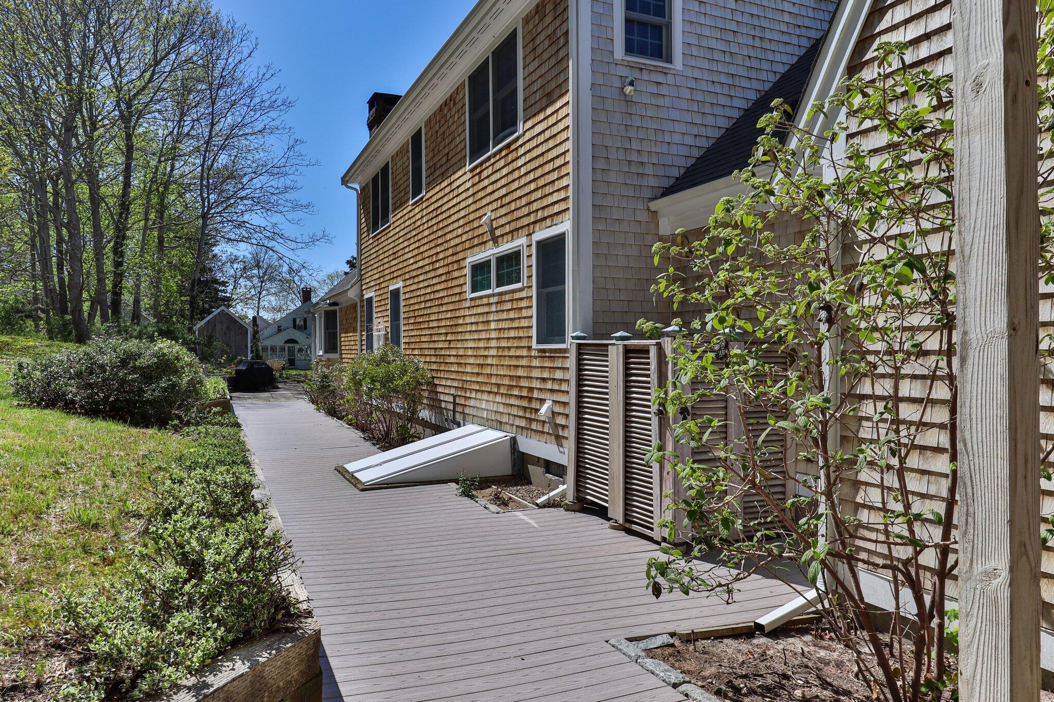35 Hamblen Farm Road Wellfleet, MA 02667 - Photo 57 of 62 a view of a patio with chairs and potted plants