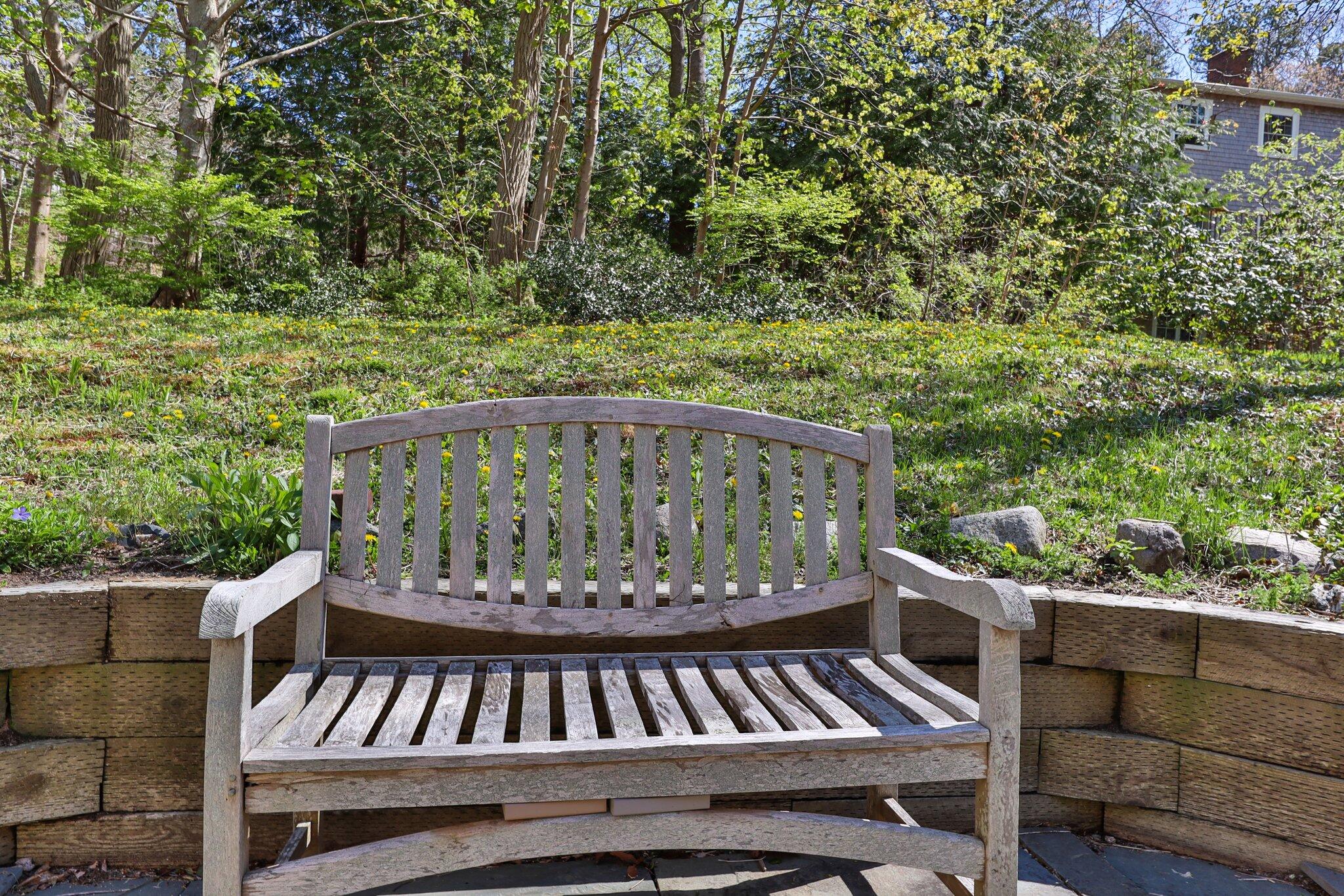 35 Hamblen Farm Road Wellfleet, MA 02667 - Photo 59 of 62 a view of a wooden chairs and bench in the outdoor space