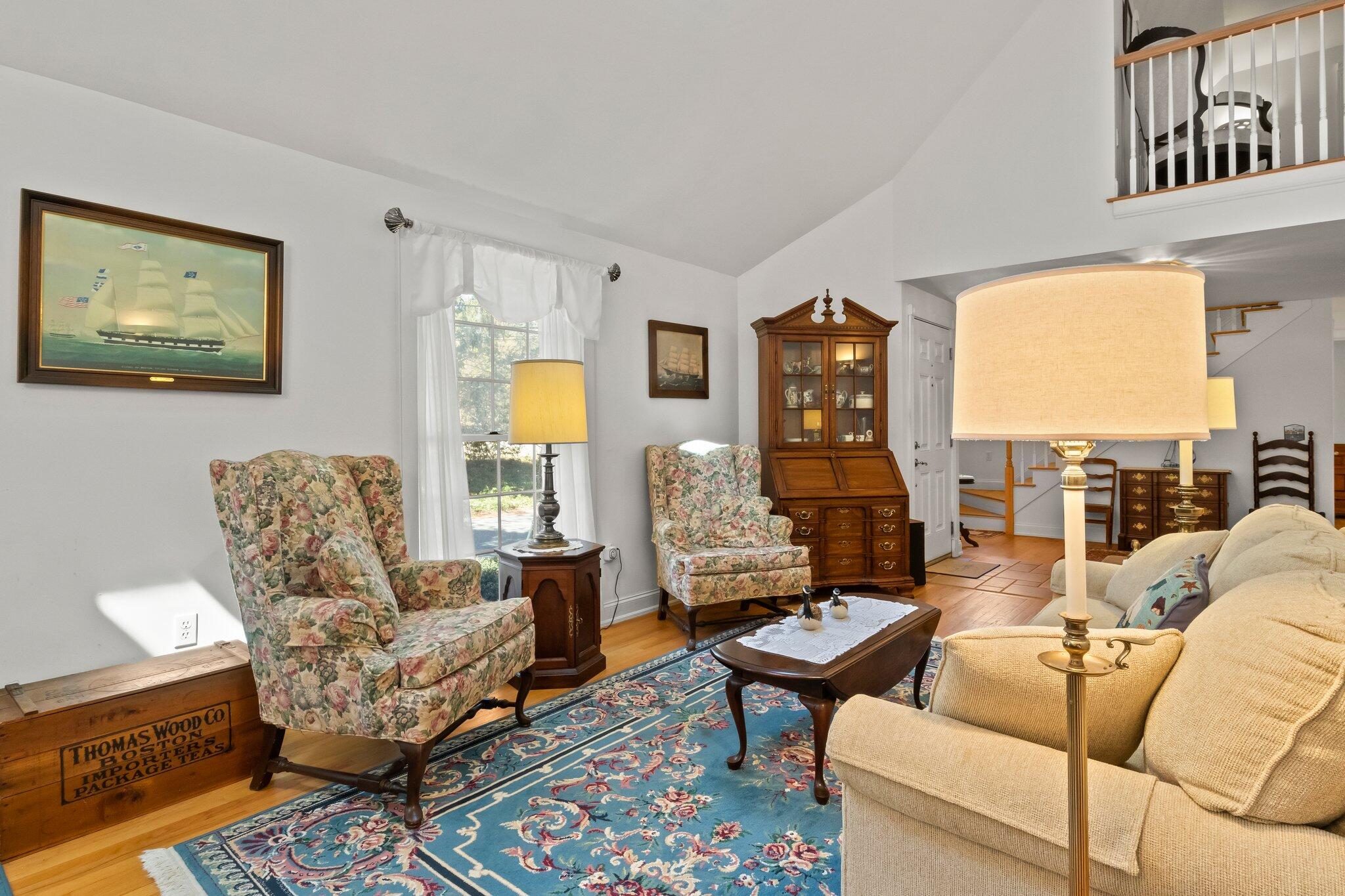 35 Hamblen Farm Road Wellfleet, MA 02667 - Photo 9 of 62 a living room with furniture and a floor to ceiling window