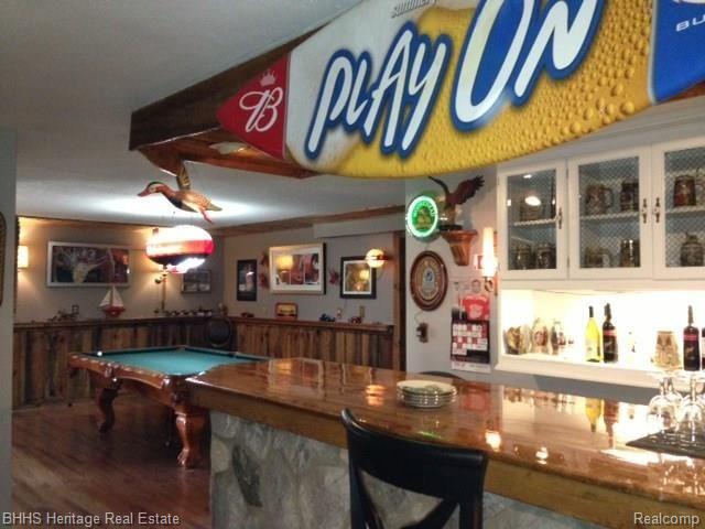 7546 West Sherwood Road Fowlerville, MI 48836 - Photo 2 of 32 Man Cave !! Fabulous bar and pool table area