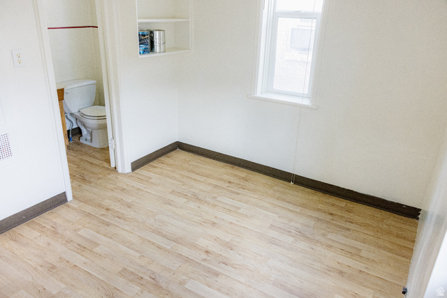 69 South Main Street Manti, UT 84642 - Photo 40 of 44 Room featuring wood-finish flooring, white walls, and dark baseboards