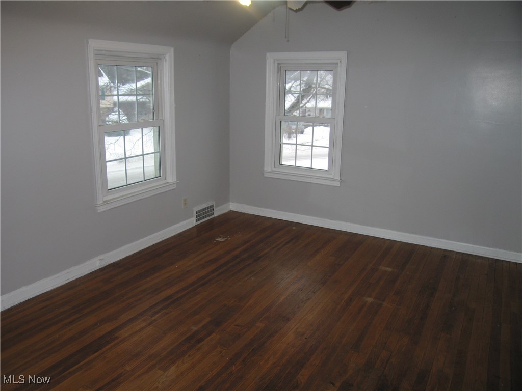 1375 Winston Road Cleveland, OH 44121 - Photo 9 of 13 Unfurnished room featuring dark wood finished floors and baseboards