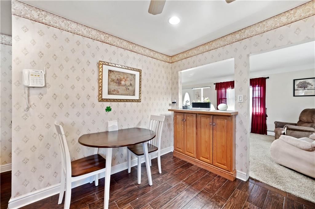 1007 Thermo Village Road New Stanton, PA 15672 - Photo 14 of 21 a dining room with furniture and wooden floor