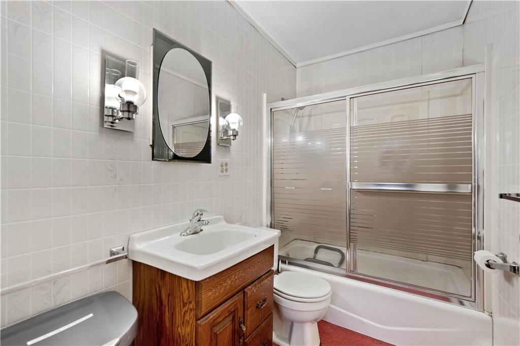 1007 Thermo Village Road New Stanton, PA 15672 - Photo 15 of 21 a bathroom with a sink toilet and shower
