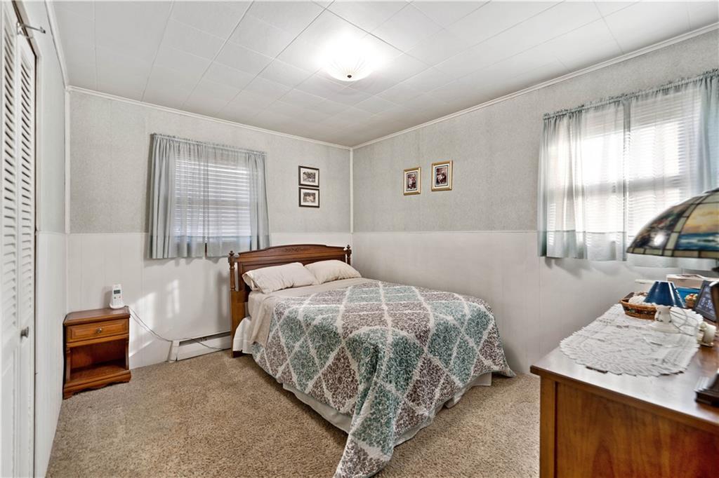 1007 Thermo Village Road New Stanton, PA 15672 - Photo 16 of 21 a bedroom with a bed and a dresser
