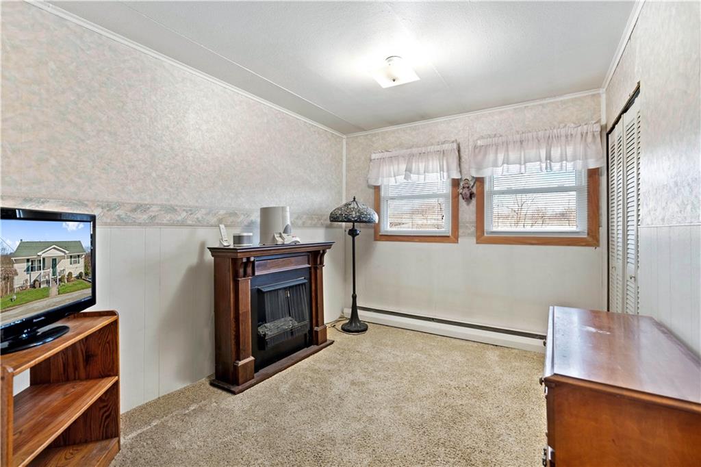 1007 Thermo Village Road New Stanton, PA 15672 - Photo 18 of 21 a view of a livingroom with furniture and a flat screen tv