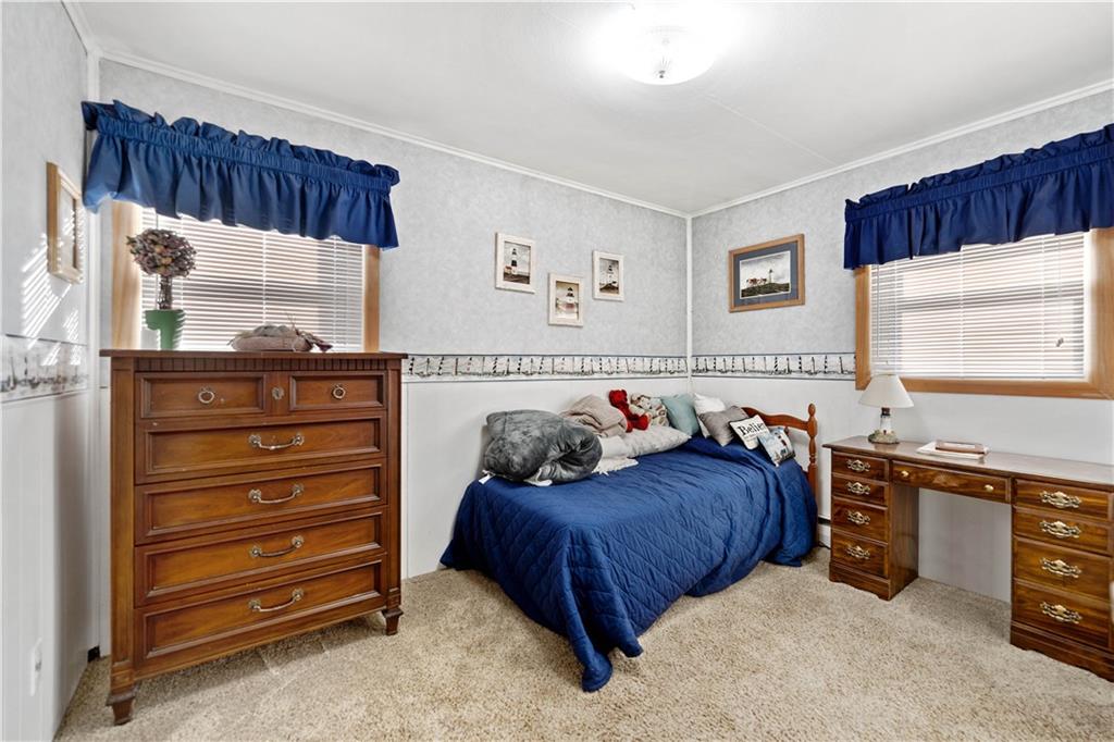 1007 Thermo Village Road New Stanton, PA 15672 - Photo 20 of 21 a bedroom with a bed and a window