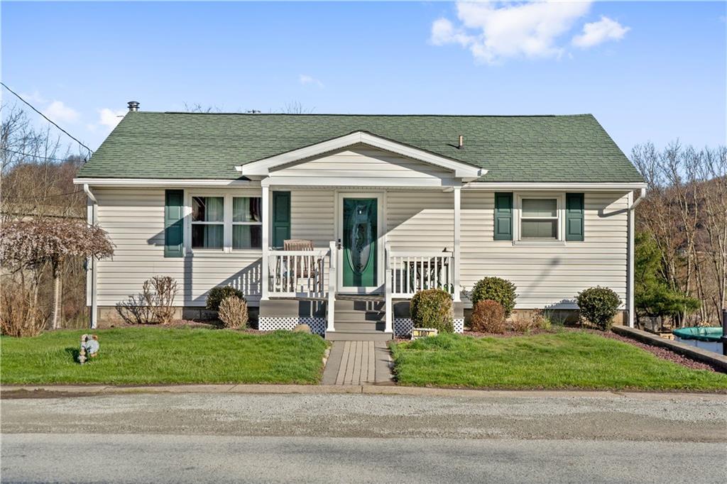 1007 Thermo Village Road New Stanton, PA 15672 - Photo 2 of 21 front view of a house with a yard