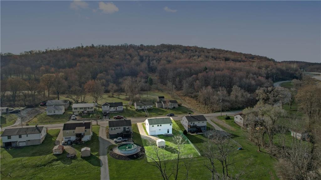 1007 Thermo Village Road New Stanton, PA 15672 - Photo 6 of 21 an aerial view of a house with a yard
