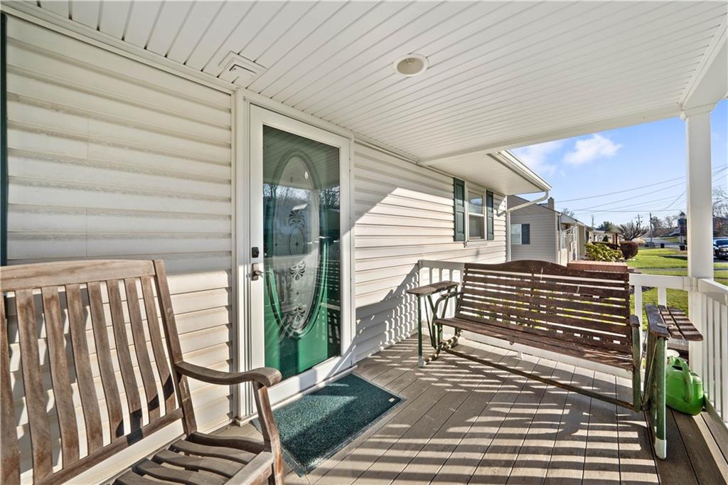 1007 Thermo Village Road New Stanton, PA 15672 - Photo 8 of 21 a view of outdoor space with deck and furniture