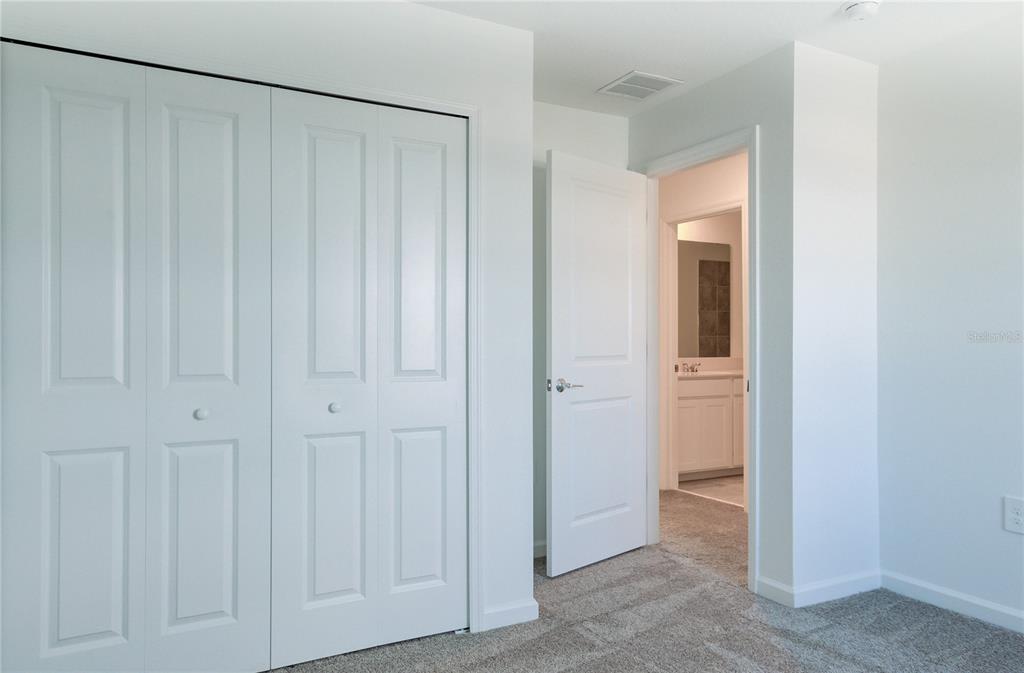 15627 Water Spring Boulevard Winter Garden, FL 34787 - Photo 19 of 45 a view of a room with a wooden door