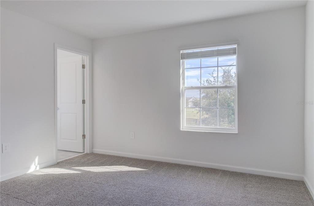 15627 Water Spring Boulevard Winter Garden, FL 34787 - Photo 26 of 45 an empty room with windows