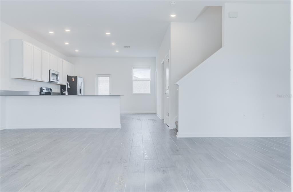 15627 Water Spring Boulevard Winter Garden, FL 34787 - Photo 30 of 45 a view of a kitchen with a sink and a refrigerator